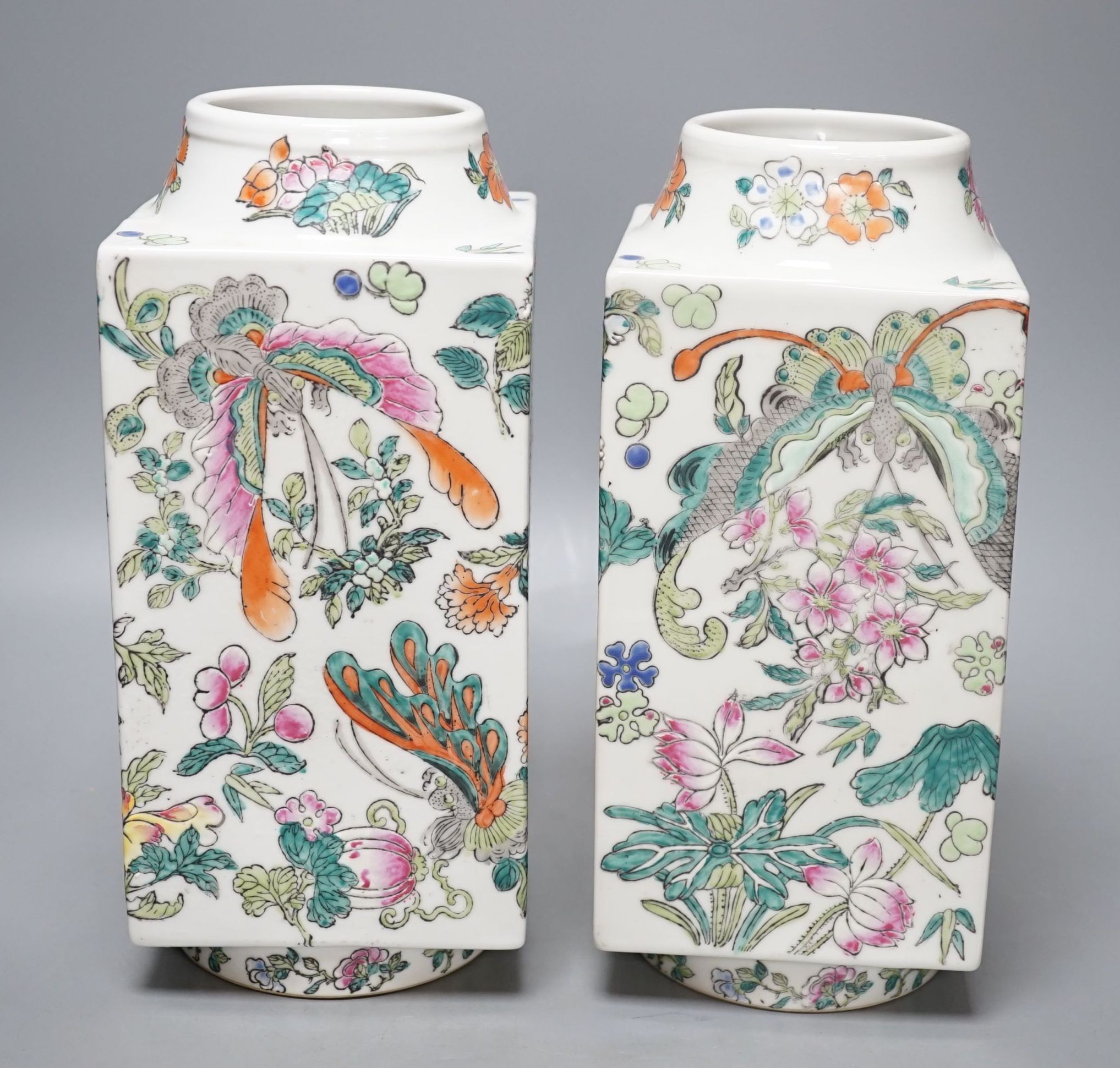 A pair of Chinese famille rose cong shaped vases, 28cms high.